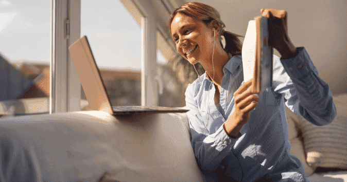 Employee coming up with fun virtual holiday party ideas with her team