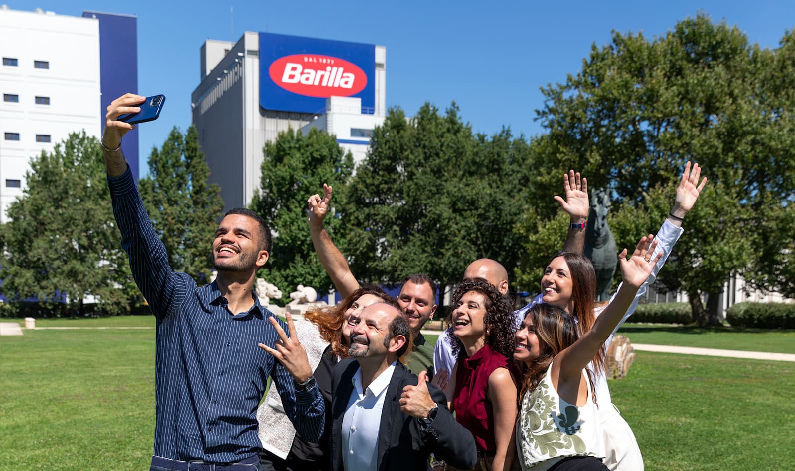 A group of employees taking a selfie outside of Barilla HQ.
