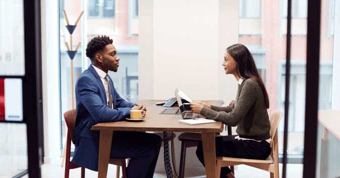 HR manager listening to an applicant during the job interview process