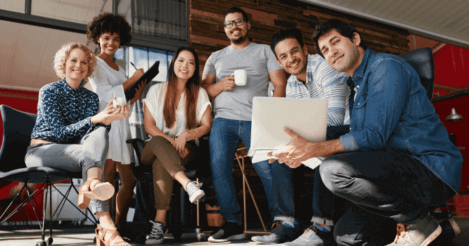 a group of employees in team meeting