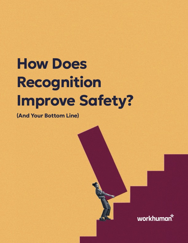 A graphic featuring a stylized illustration of a person in business attire pushing a large red block up some stairs, symbolizing progress or effort. Above the image, the text reads, "How Does Recognition Improve Safety? (And Your Bottom Line)" with the Workhuman logo at the bottom right corner. The background is a solid yellow color, which emphasizes the main elements of the design.