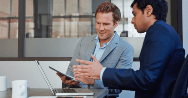 employees reviewing recruiting and hiring data