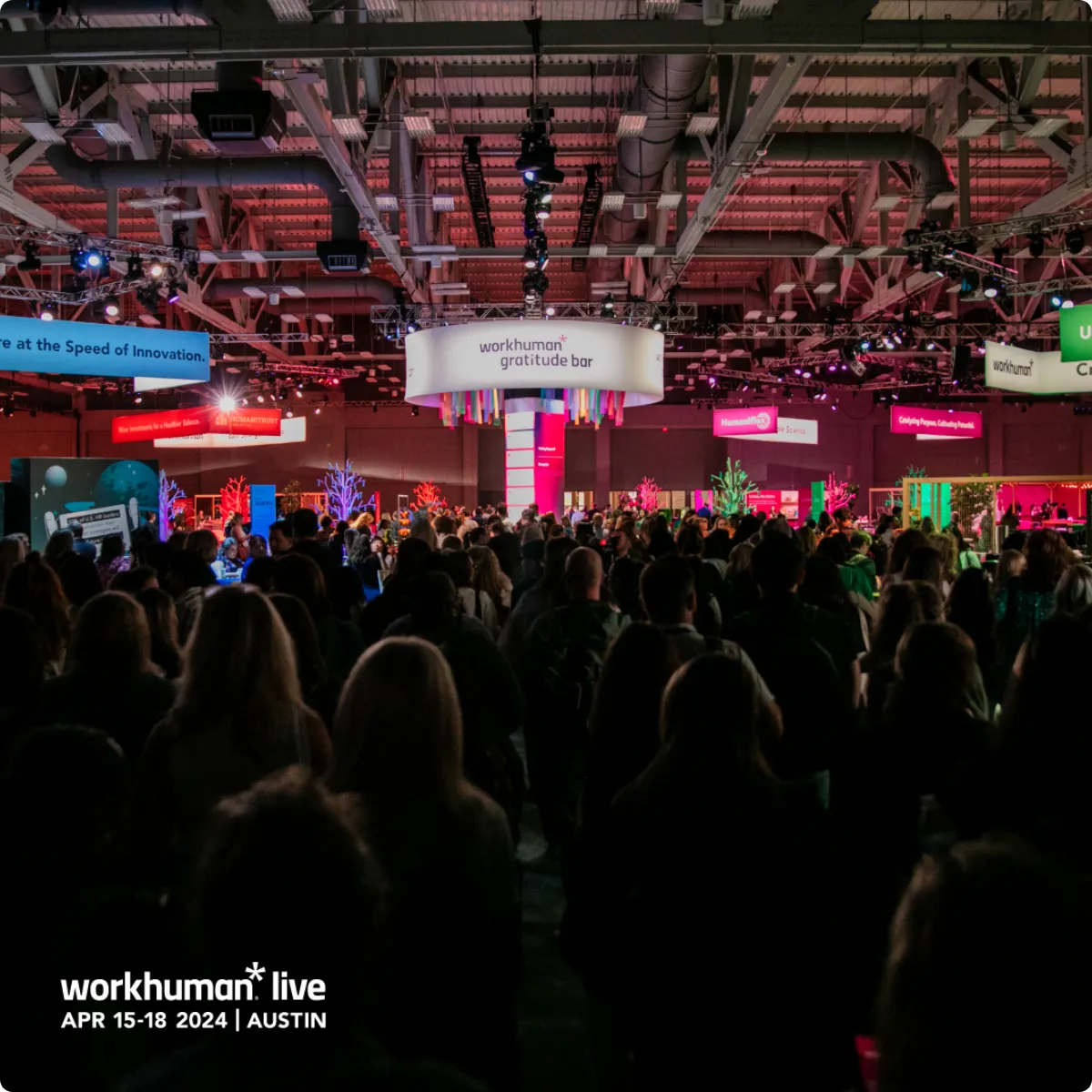 Workhuman Live 2024 attendees interacting at the Workhuman gratitude bar.