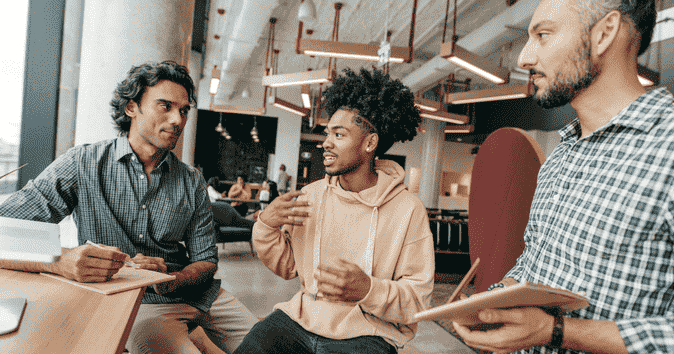 people of color discussing structural racism and inclusive workplace culture