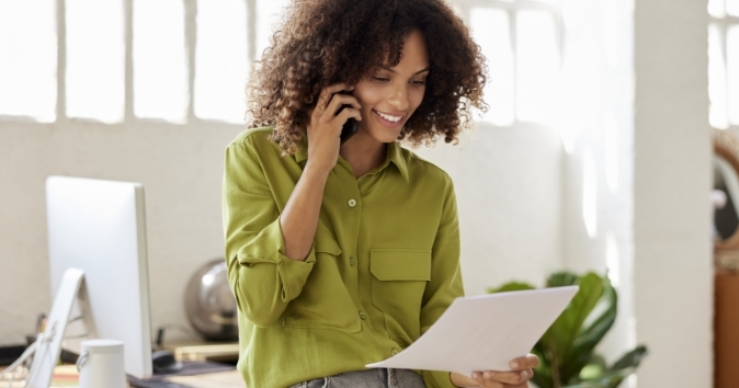 woman discussing her benefits certification