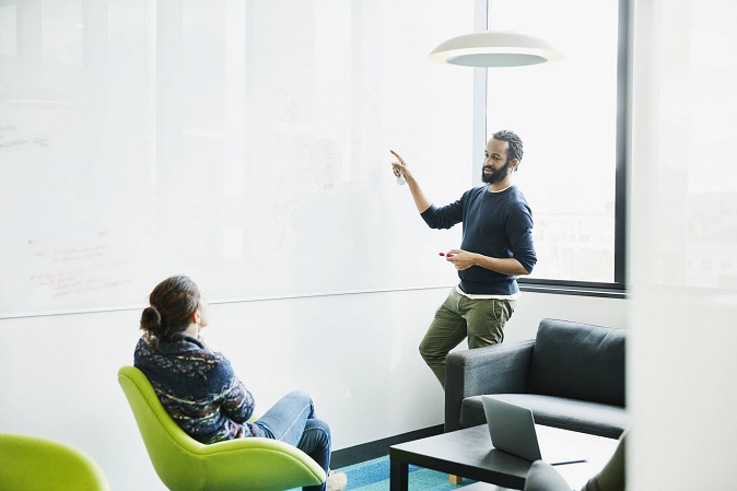 Employees contributing in a meeting about workplace wellness programs