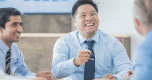 three men in business attire meeting