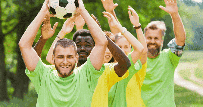 A team playing soccer in a free outdoor area