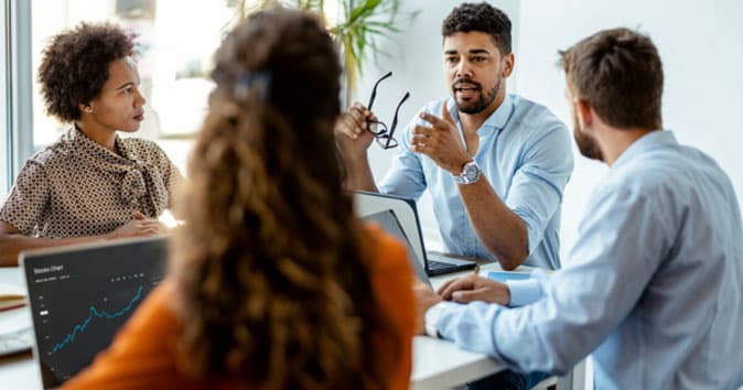 A team brainstorming to achieve the goals that are set