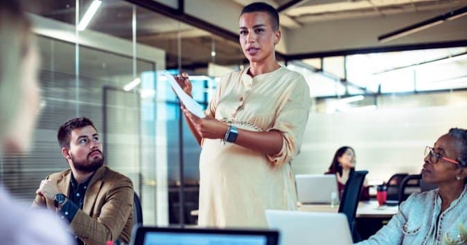 collaborating team members in a meeting room