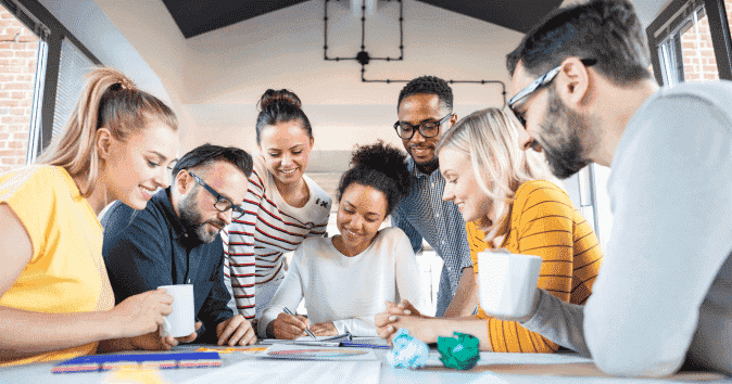a group of employees playing a quick team-building game indoor
