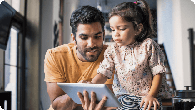 man holding tablet for child
