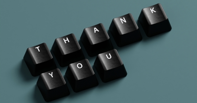 Keyboard keys spelling out thank you.