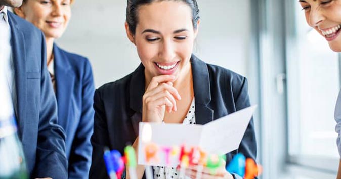 A group of people is celebrating a birthday.