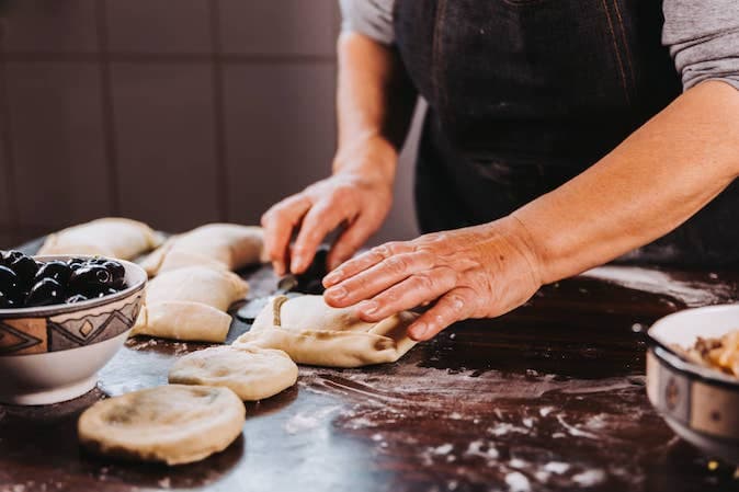 Organize a cooking class that centers on a native dish