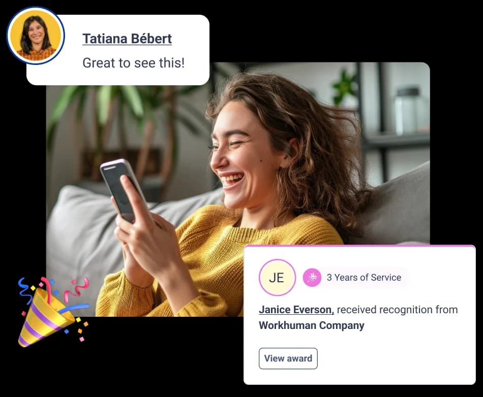 A smiling woman holding a smartphone, appearing joyful as she looks at the screen. She is wearing a black blazer over a light-colored blouse, with her hair styled in short curls. The background is a soft blue, enhancing her expression of happiness.