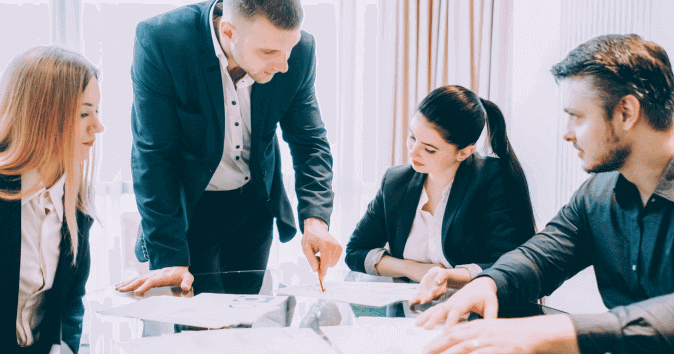 a mentor guiding his team