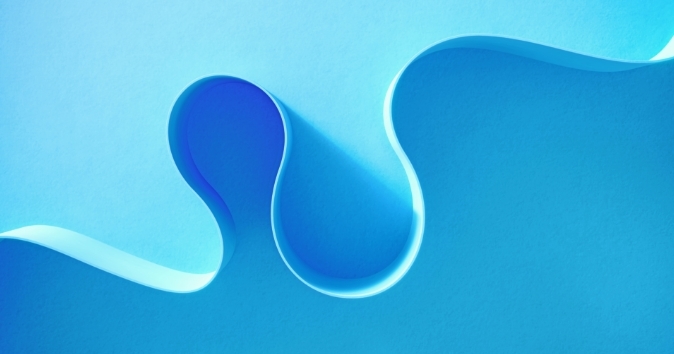 A side view of a ribbon of blue going up from left to right.