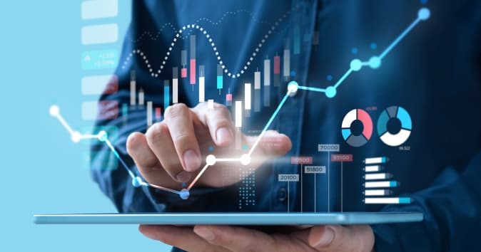 Person holding a tablet with data graphics overlayed over image.