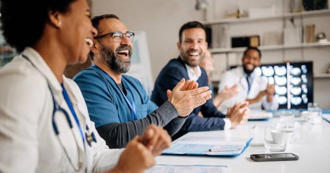 people sitting around the table and laughing